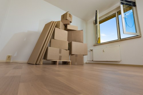 Movers transporting furniture and boxes during a local relocation