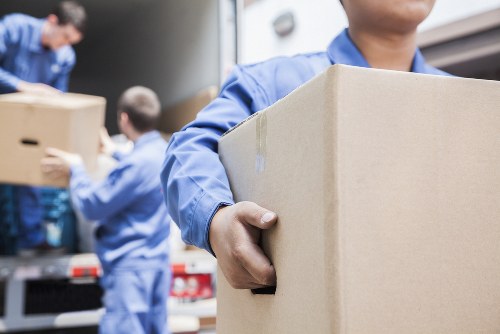 Student removals team loading boxes in Swiss Cottage