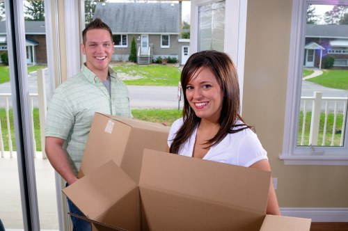 Unloading boxes and furniture into a new Swiss Cottage property