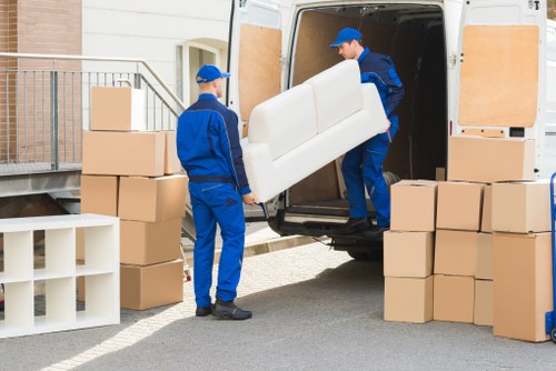 Loading furniture into a truck for a house move near Swiss Cottage