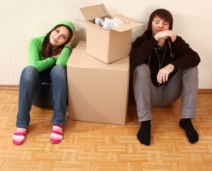 Local movers handling furniture and boxes with care during a move