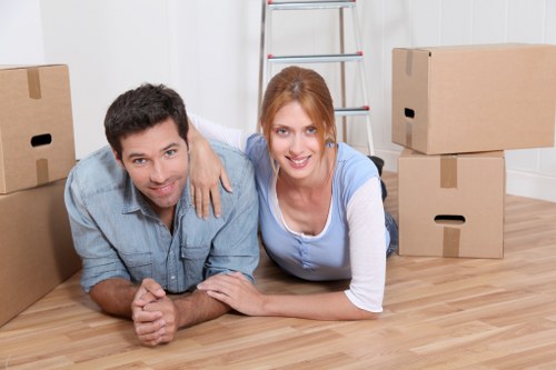 Furniture and boxes being unloaded at a new home in Swiss Cottage