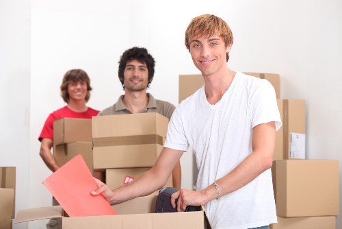 Student moving checklist and packed boxes prepared for removals in Swiss Cottage