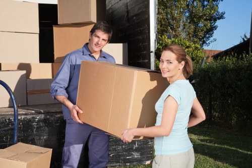 Packed office boxes and protected equipment ready for a Swiss Cottage business move
