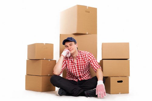 Packed moving boxes stacked neatly for a local relocation in Swiss Cottage